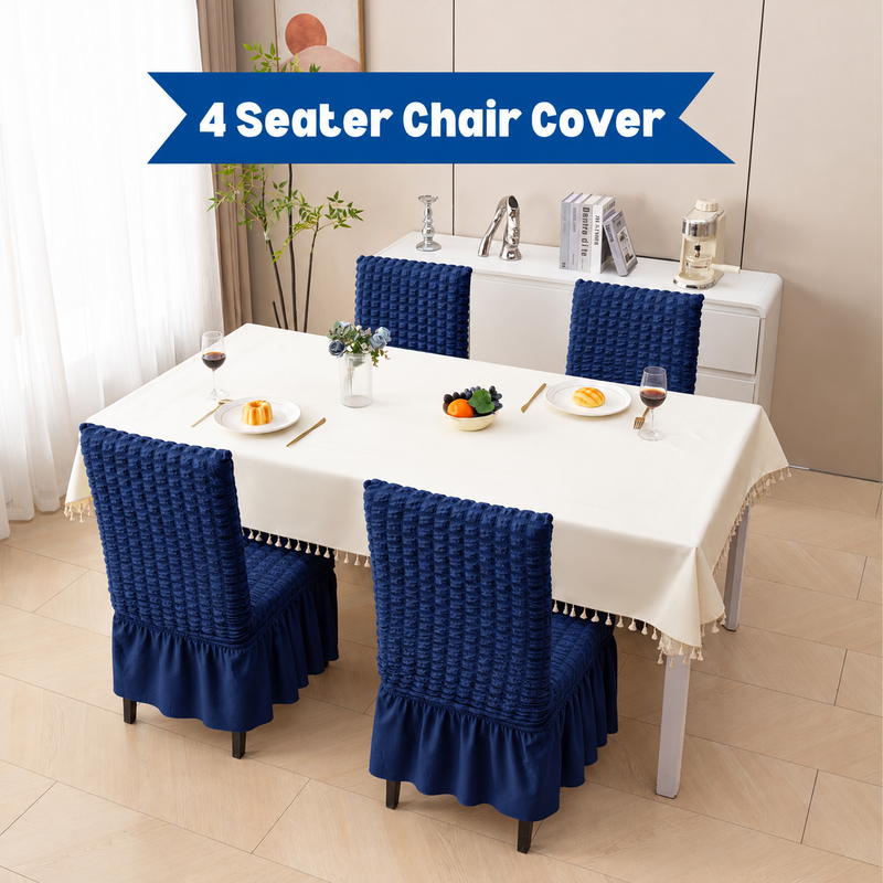 Four Dark-Blue bubble-textured chair covers with frill around a dining table